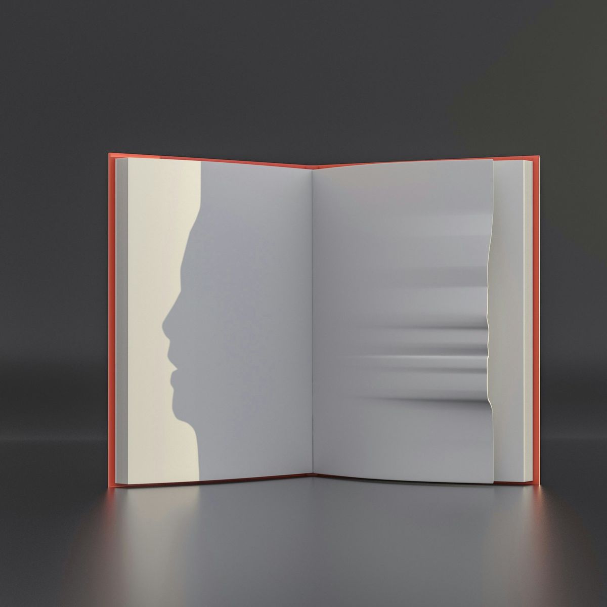 An open book with the silhouette of a face cut into its pages
